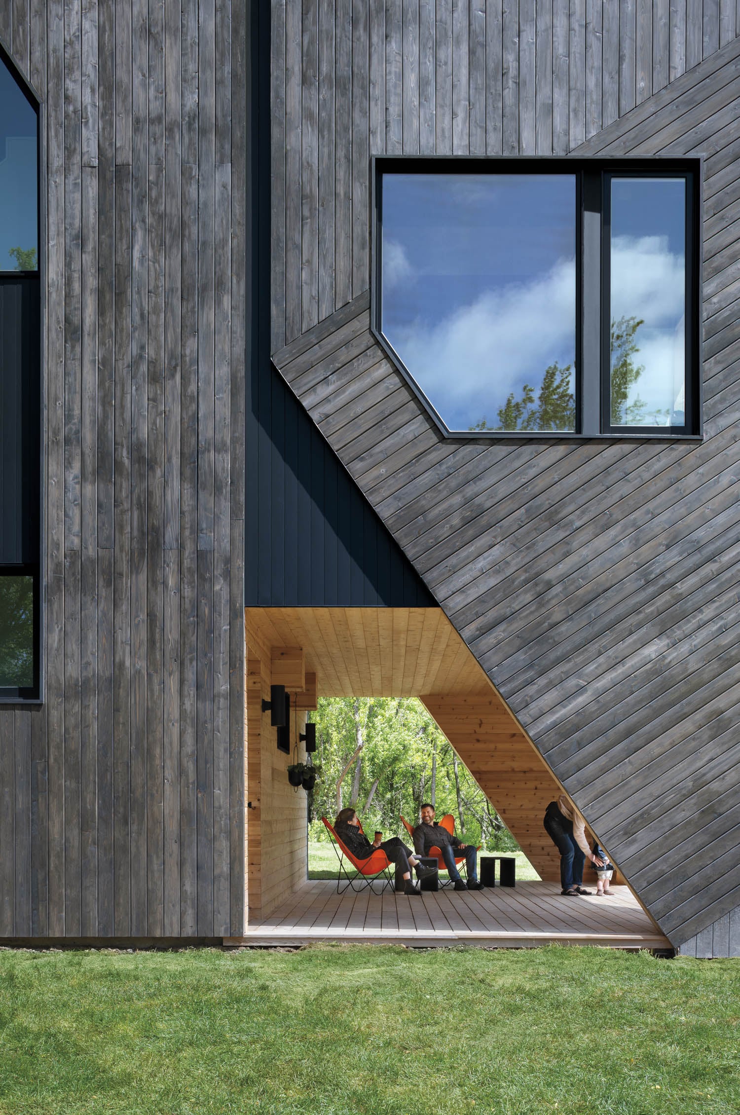 wooden exterior of home with peek of inside of home with wooden panels