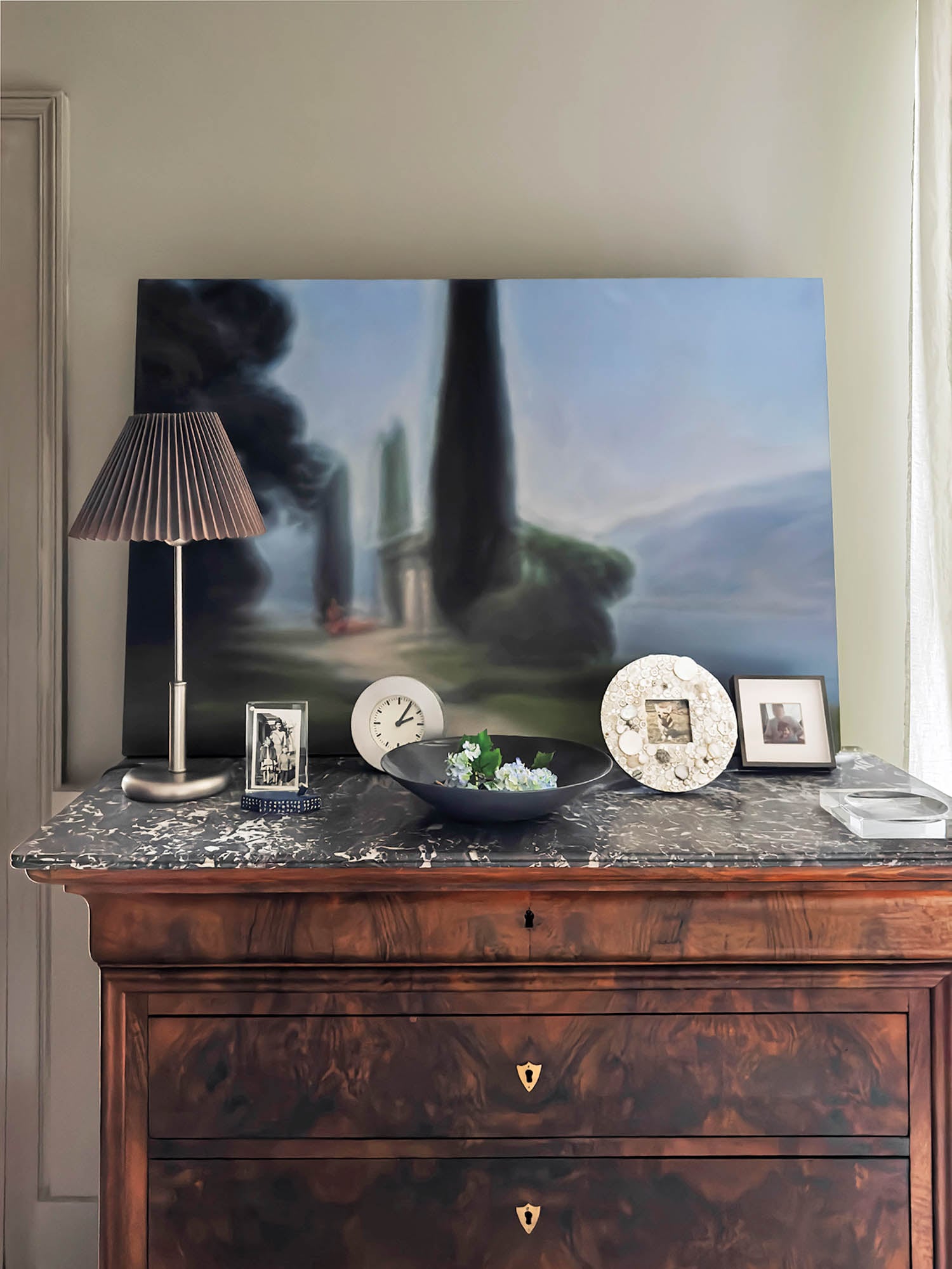 main bedroom with antique dresser and painting