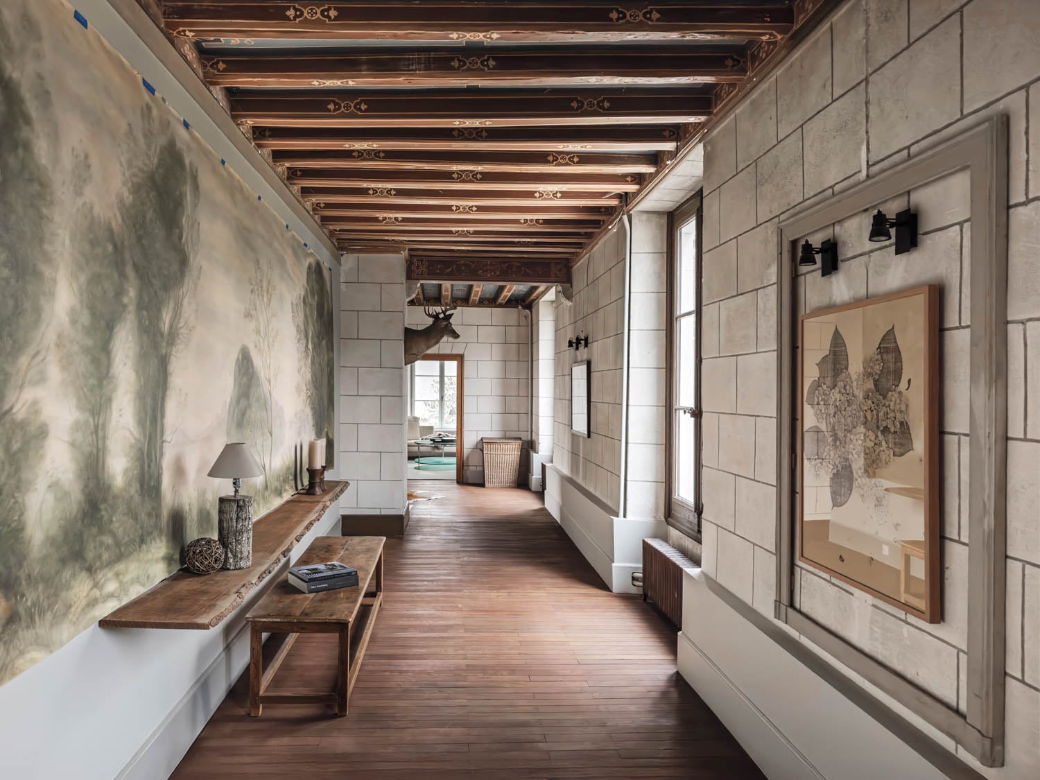 hallway with console next to an art piece