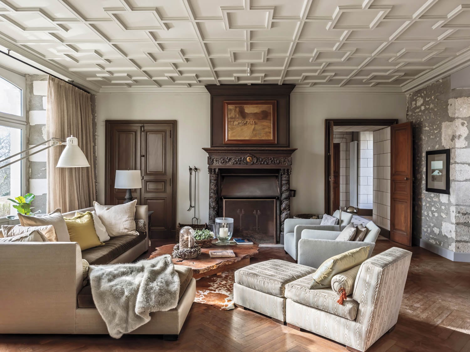 living room with white couches and chocolate brown doors and fireplace