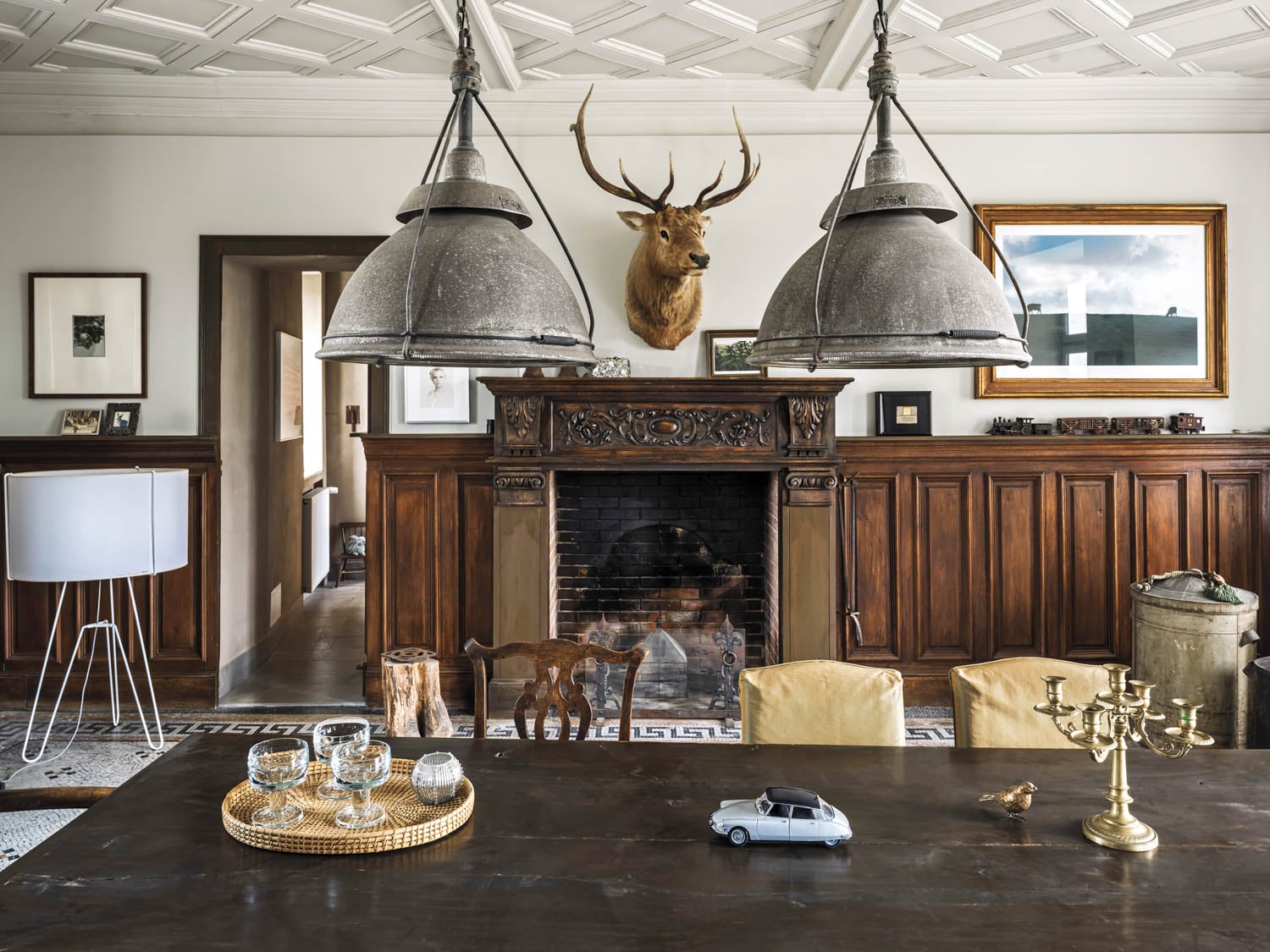 dining room with elk mounted over fireplace