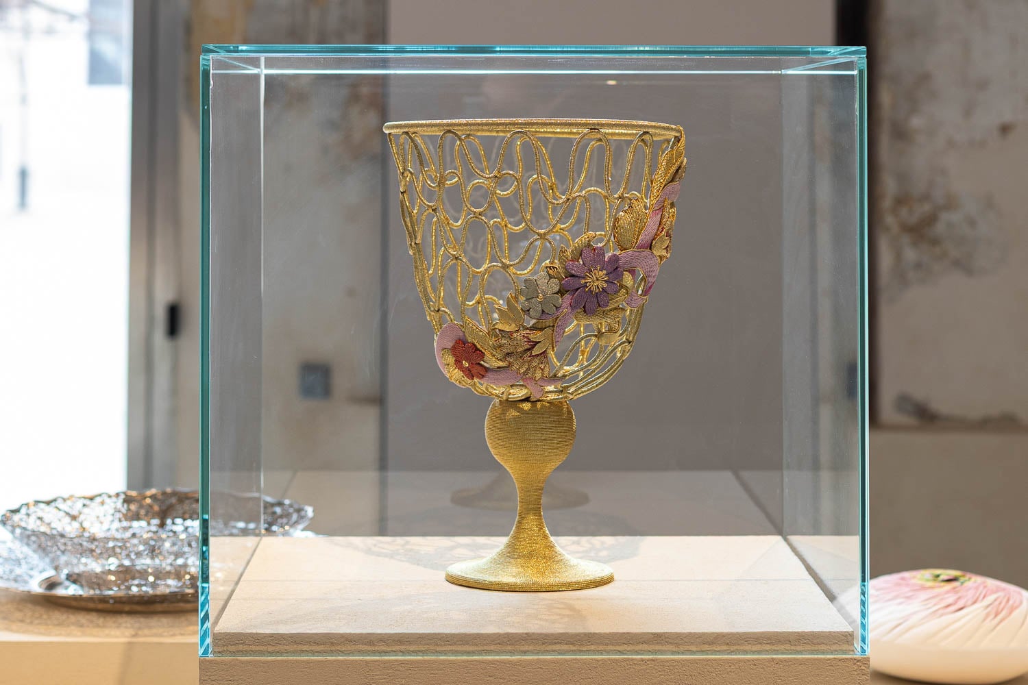 golden goblet in a glass case