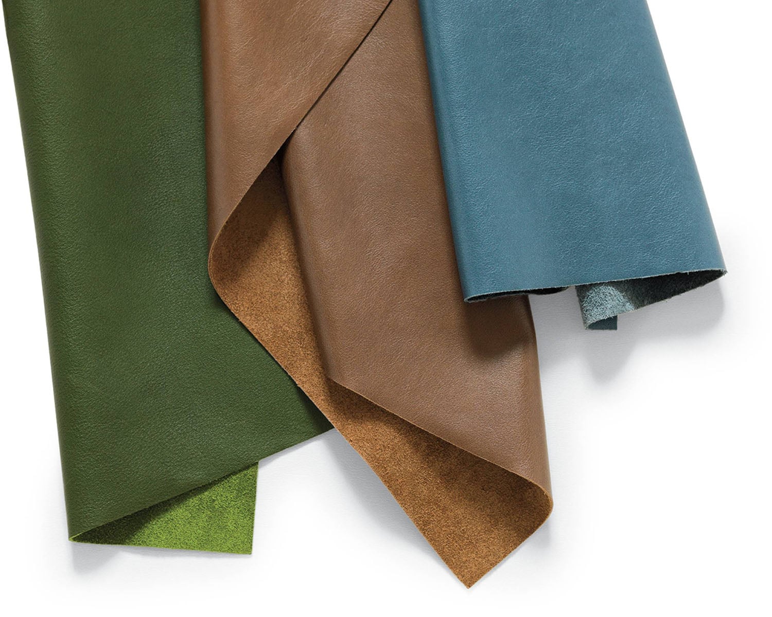 A set of four leather napkins.