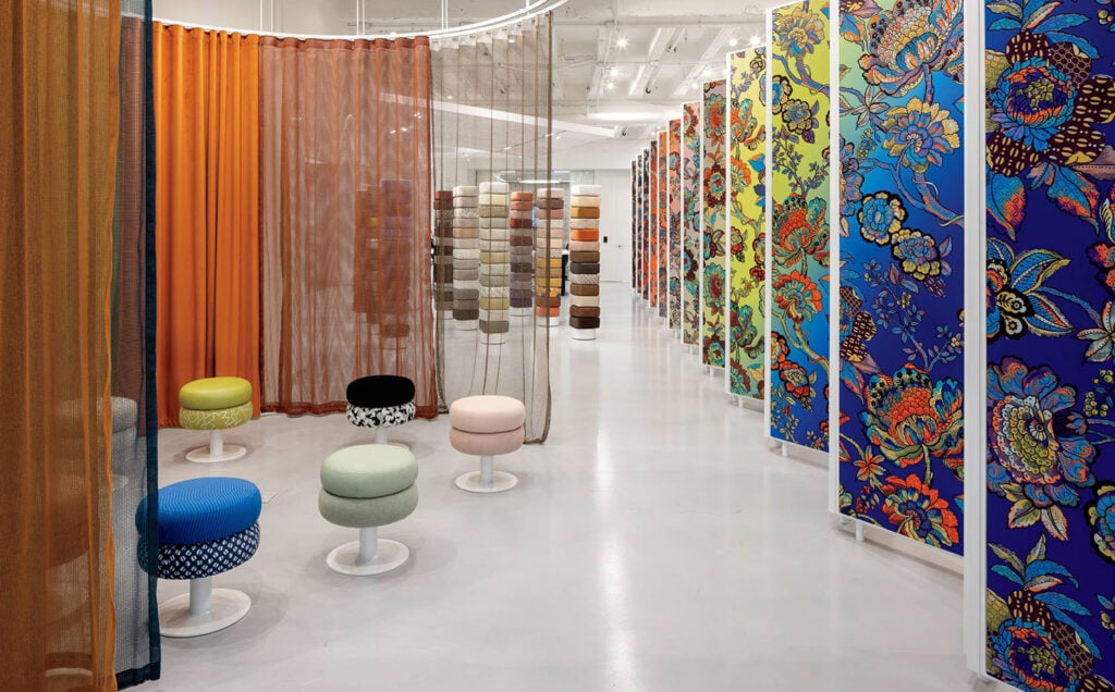 A colorful room with colorful curtains and colorful chairs.