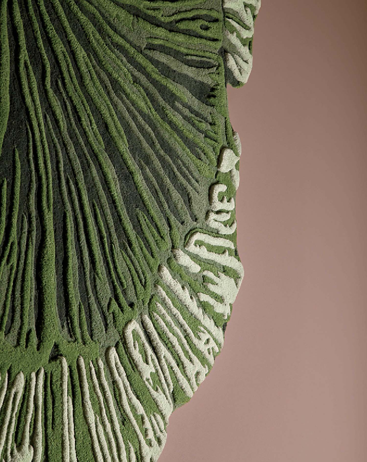 A green sculpture with a large leaf on top.