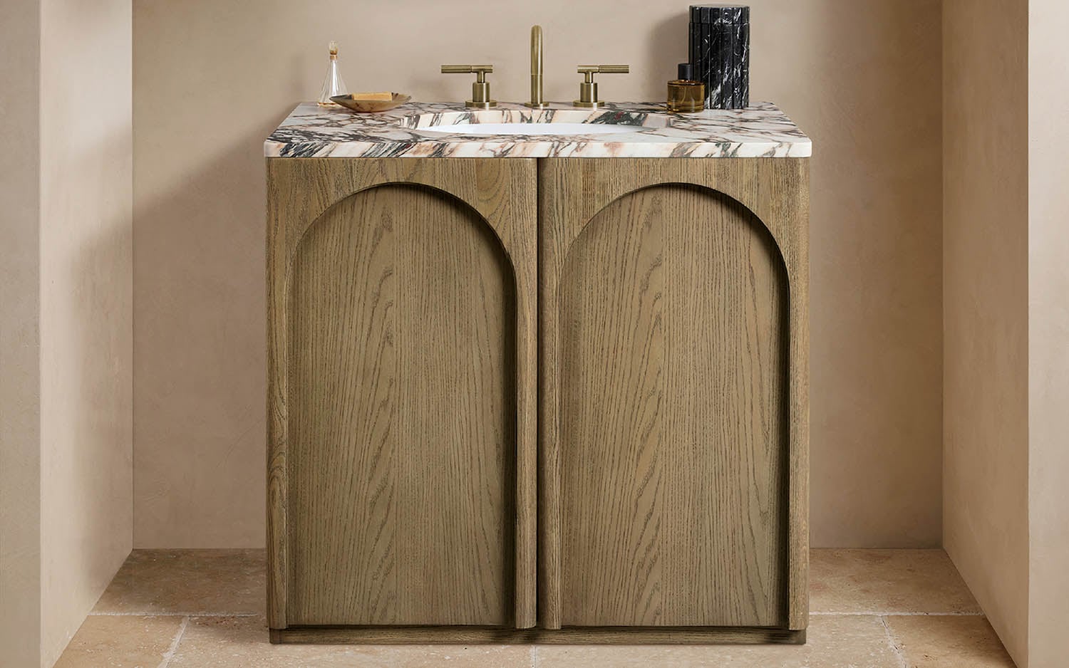 A bathroom vanity with a marble counter top.
