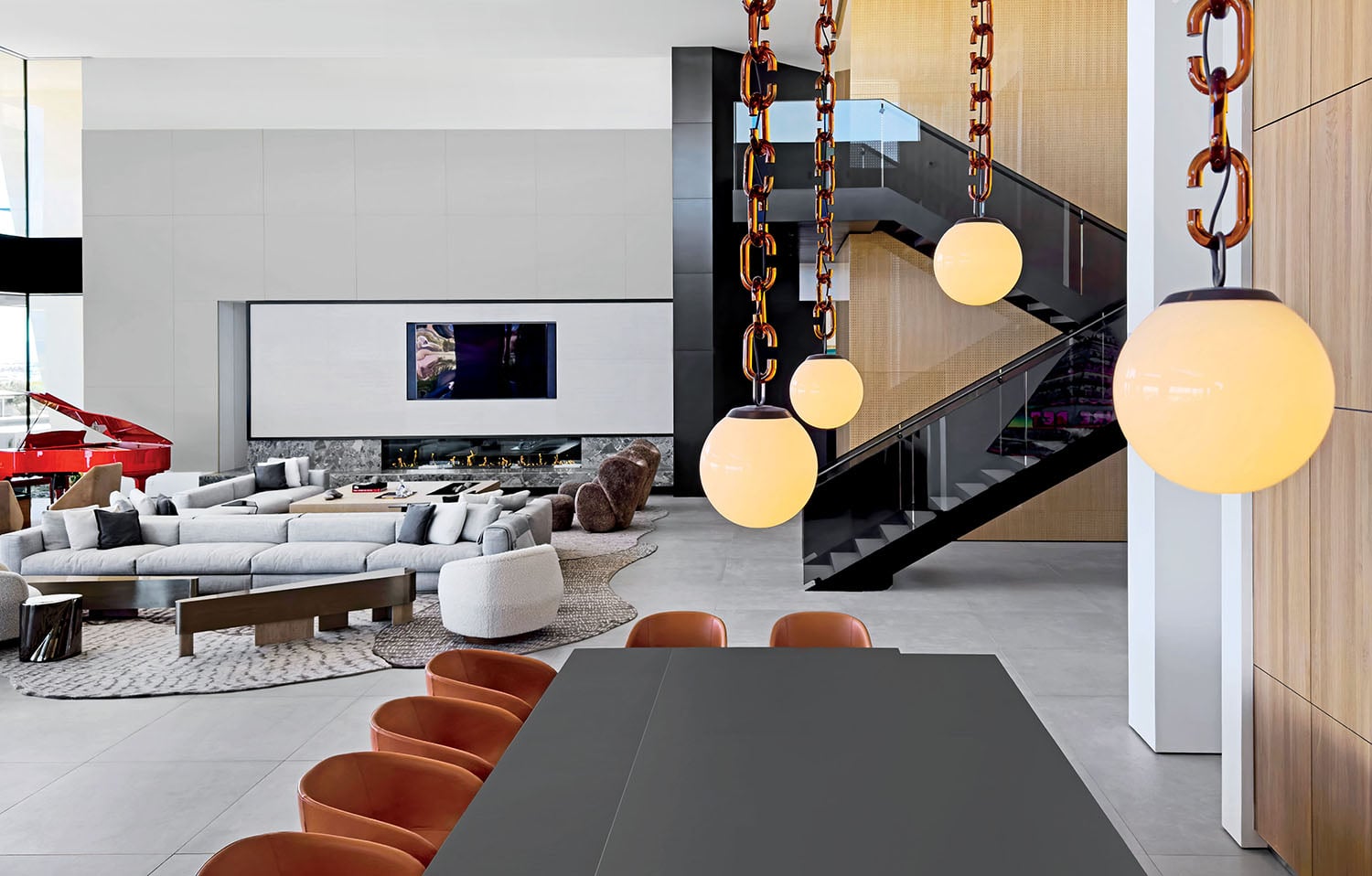 A living room with a large staircase and a staircase.