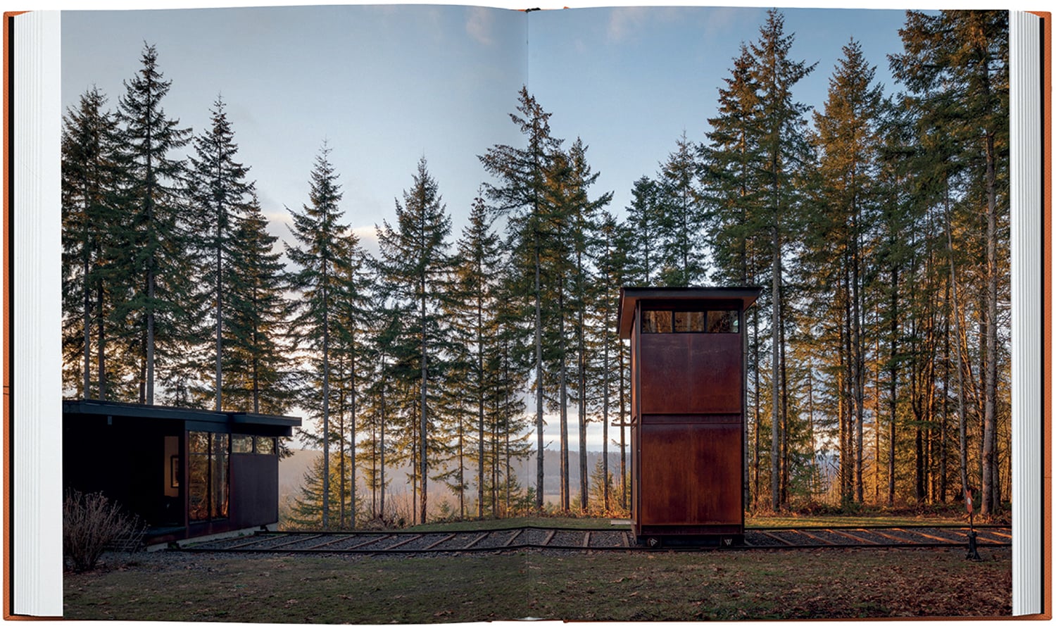 a book with a picture of a cabin in the woods