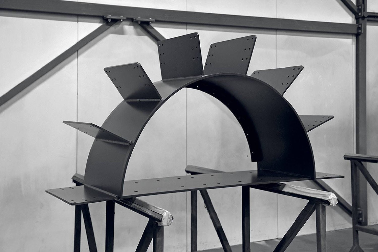 A black and white photo of a metal structure.