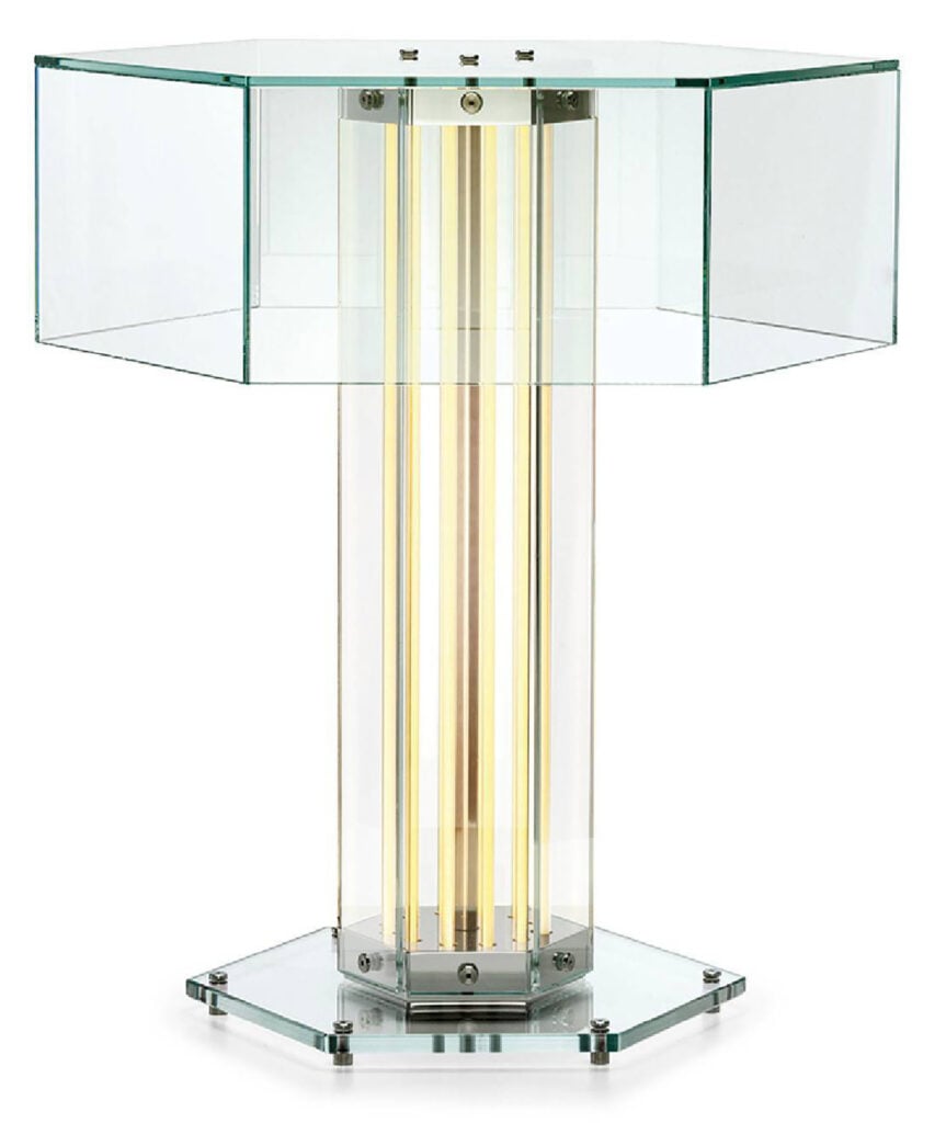 A glass table lamp with a metal base and a glass shade.