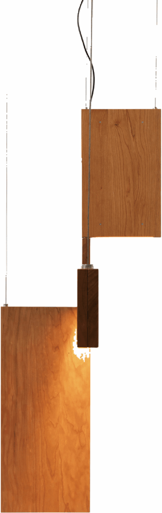 A wooden lamp with a metal holder.