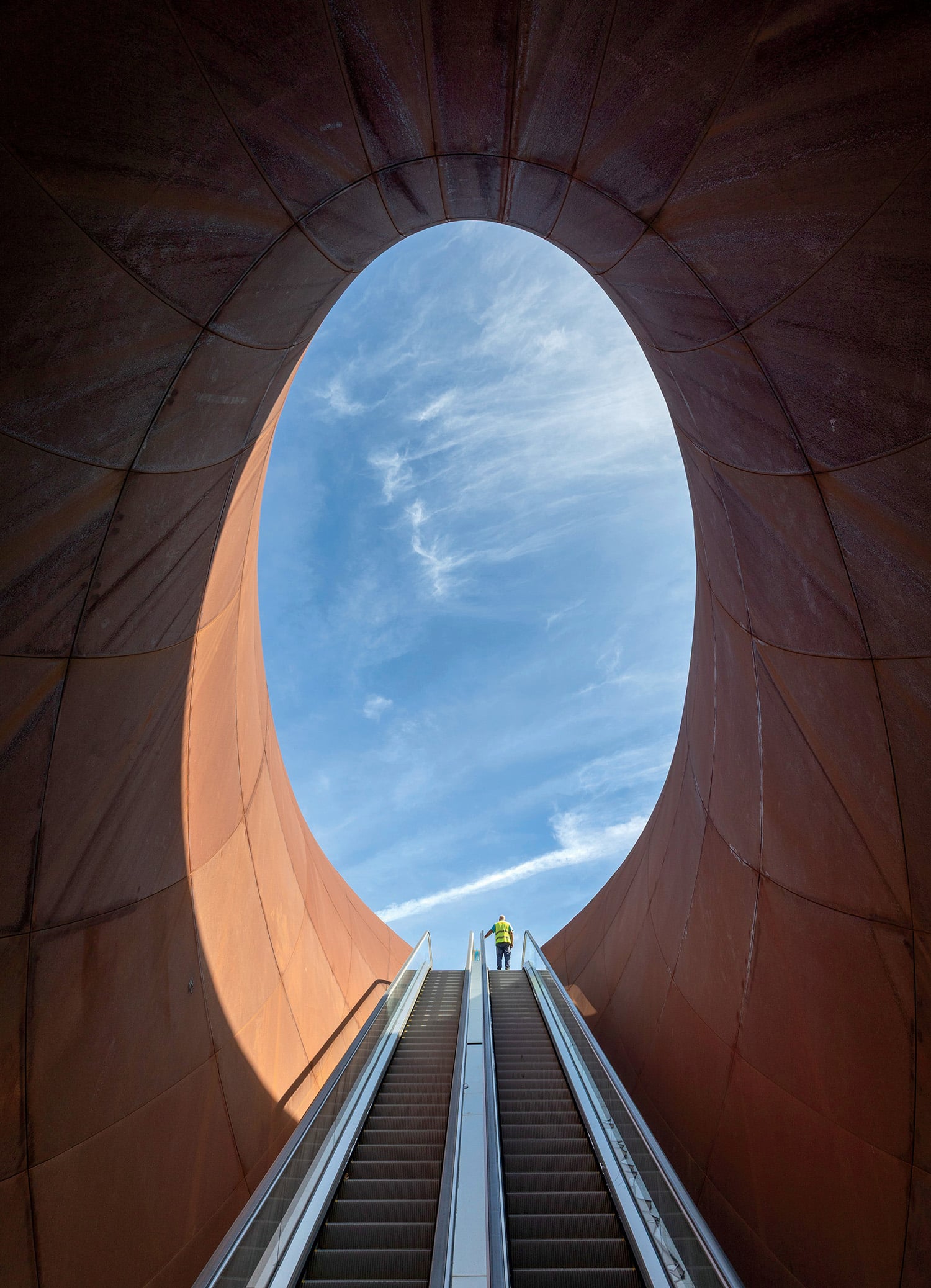 a man is walking up a set of stairs