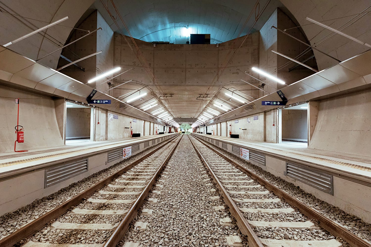 A train track with a train in the middle.