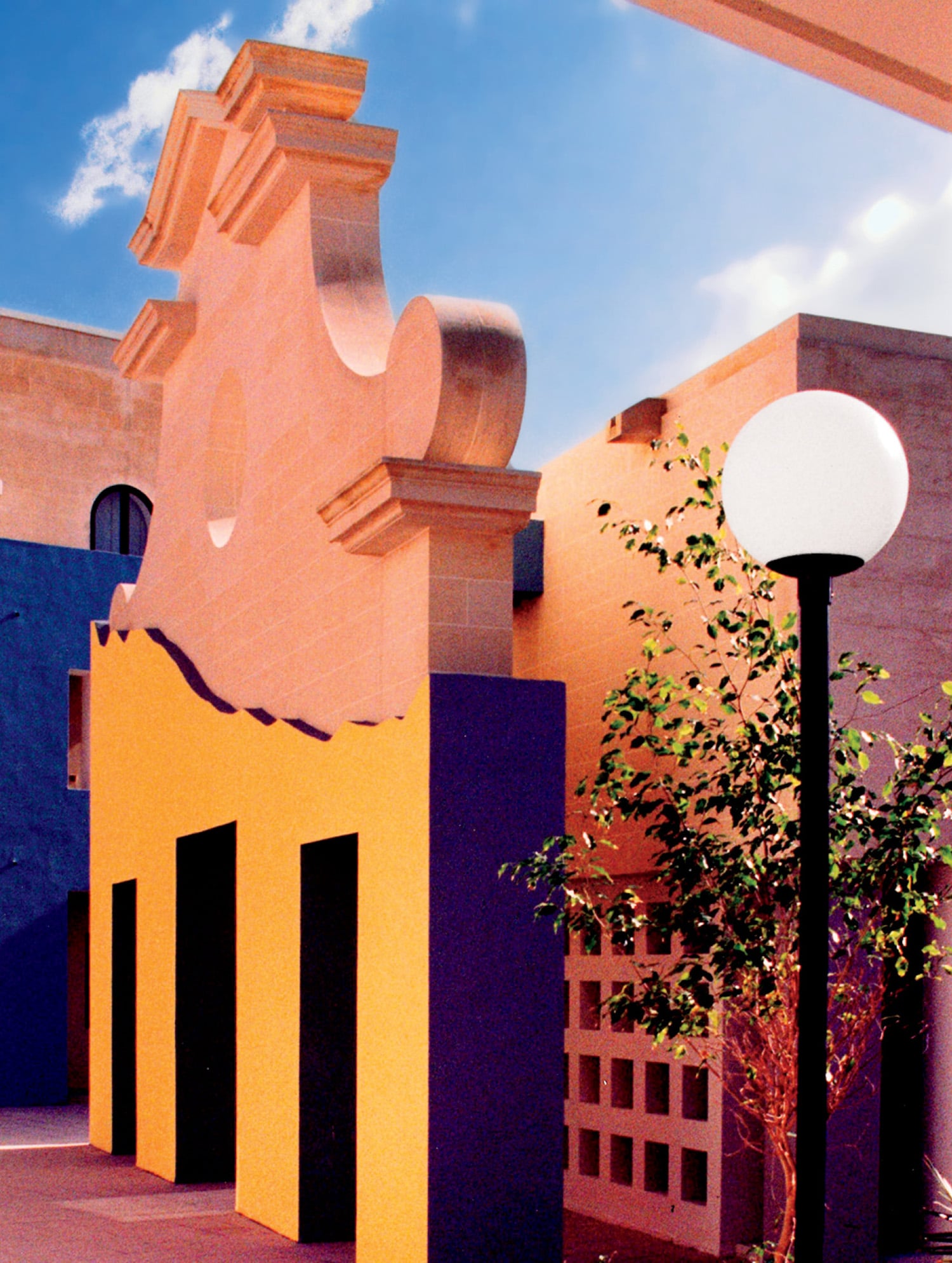 A tree in front of a building.