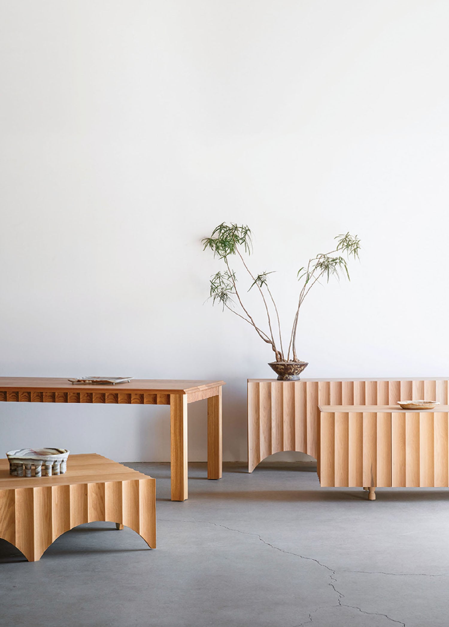 A wooden table and two benches in a room.