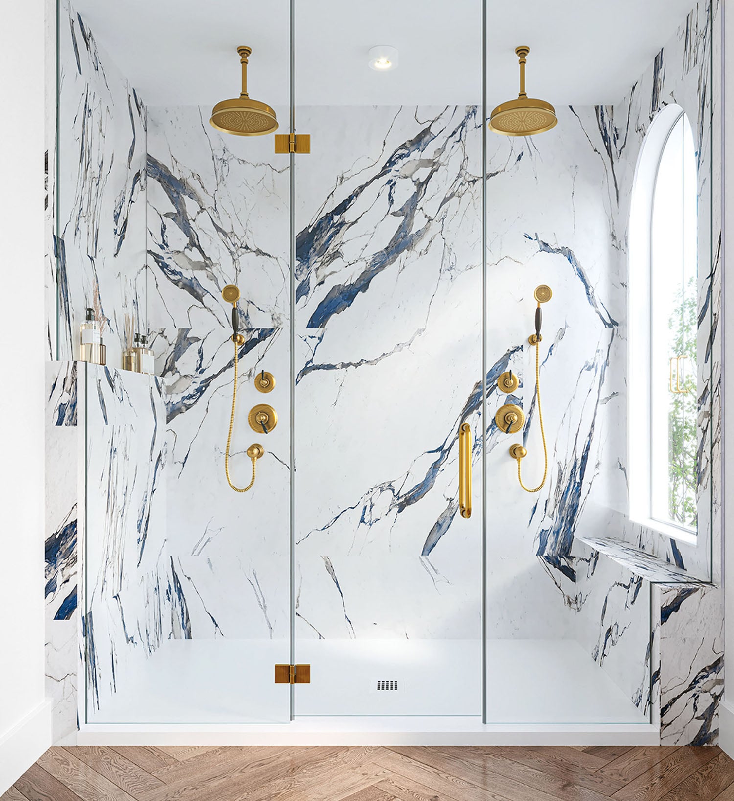 A bathroom with a marble shower and a gold fa fa fae fae fae fae.