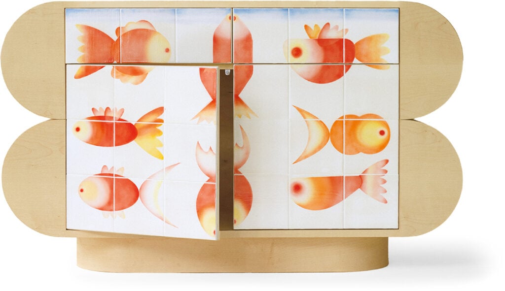 a wooden cabinet with a painting of fish on it