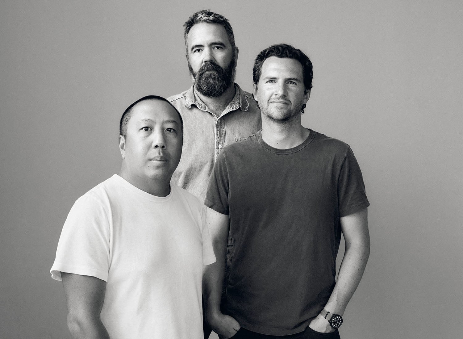 Three men standing next to each other