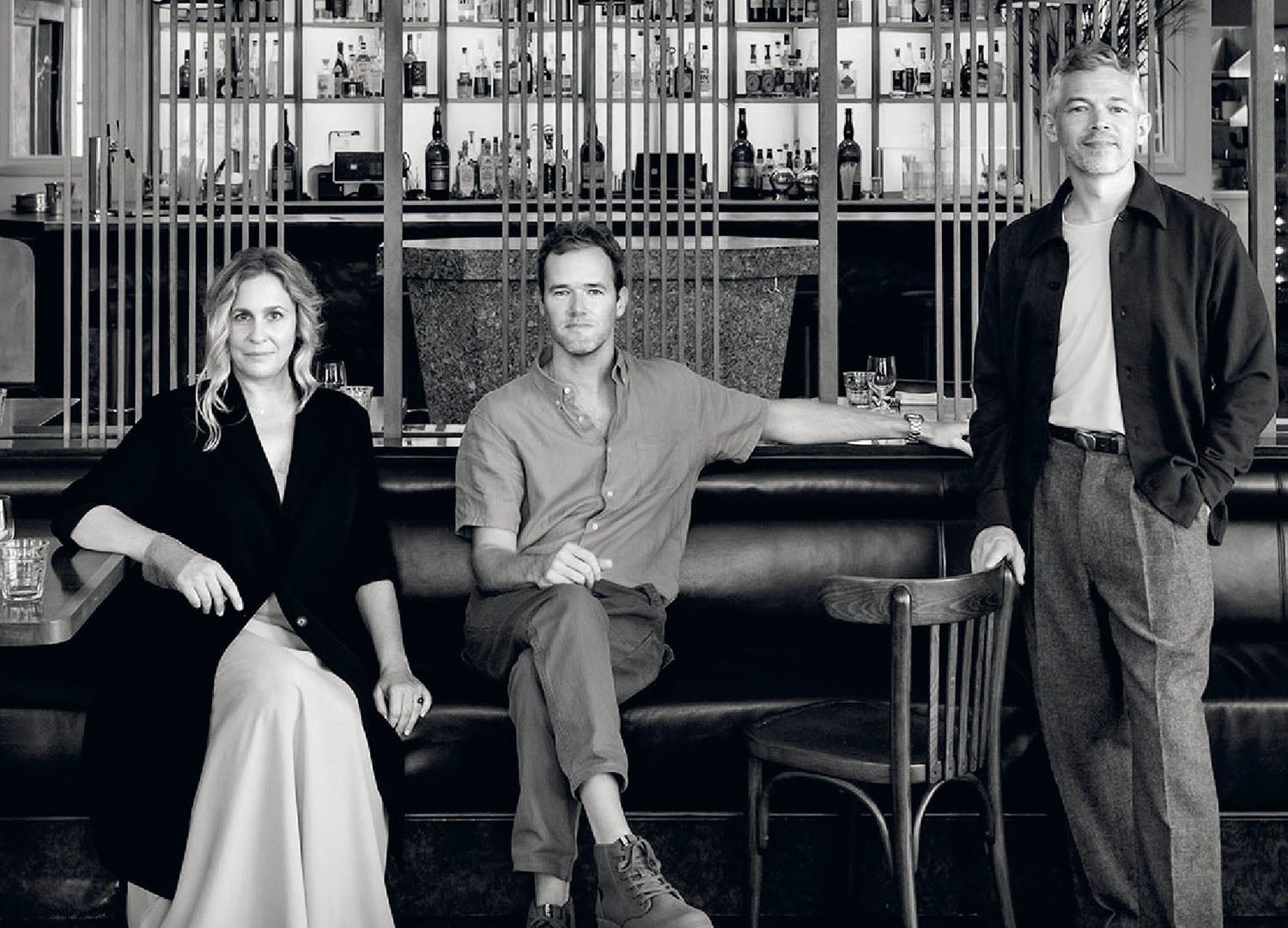 A man and woman sitting on a couch.