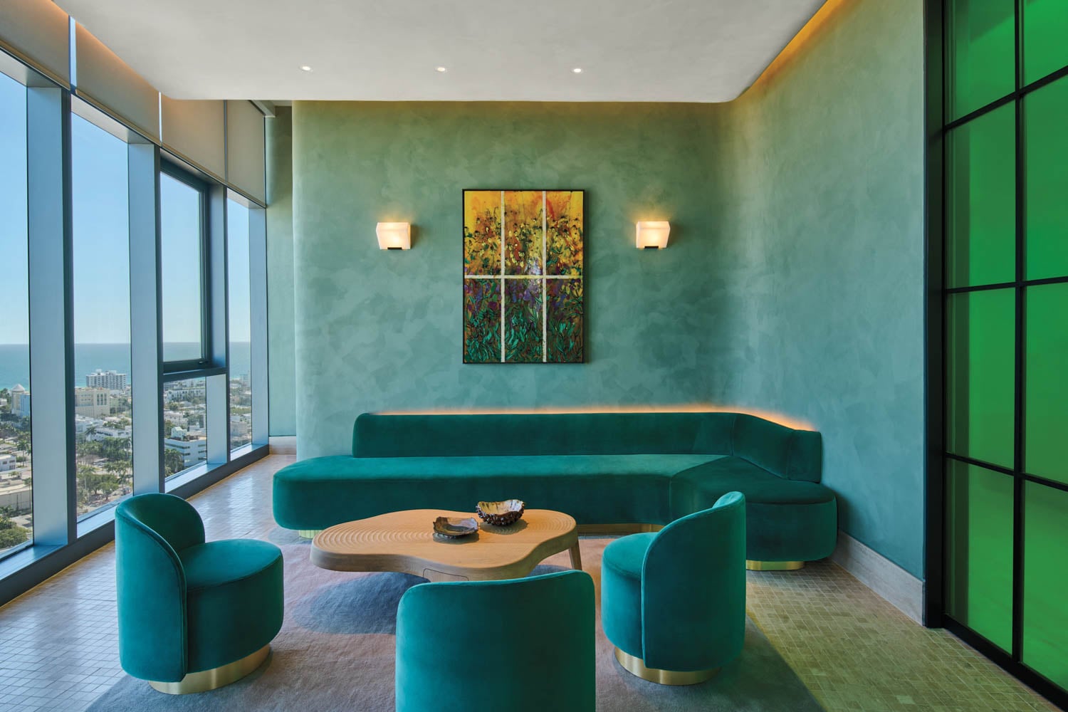 plush velvet green sofa with matching chairs