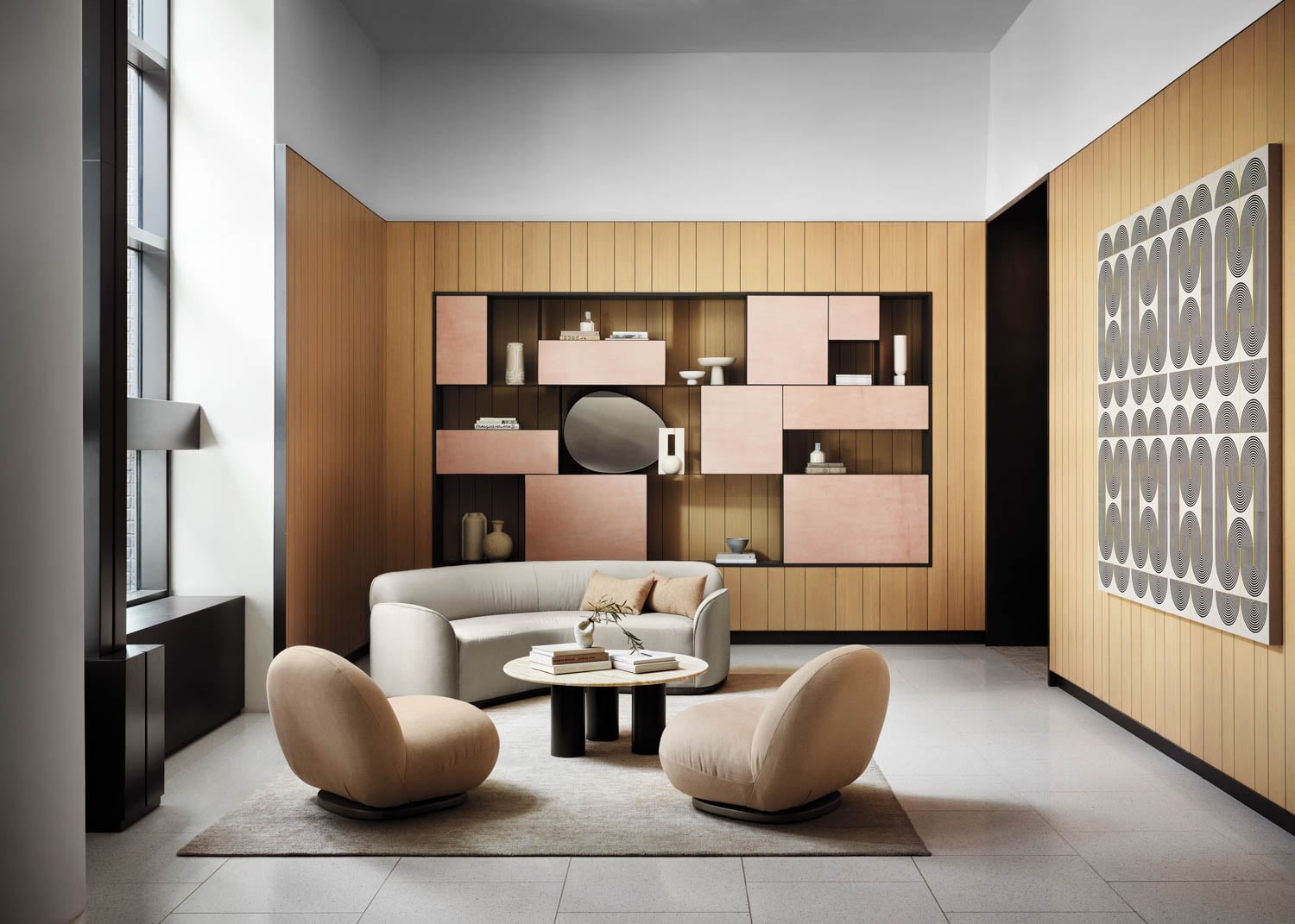 two tan chairs in a common room