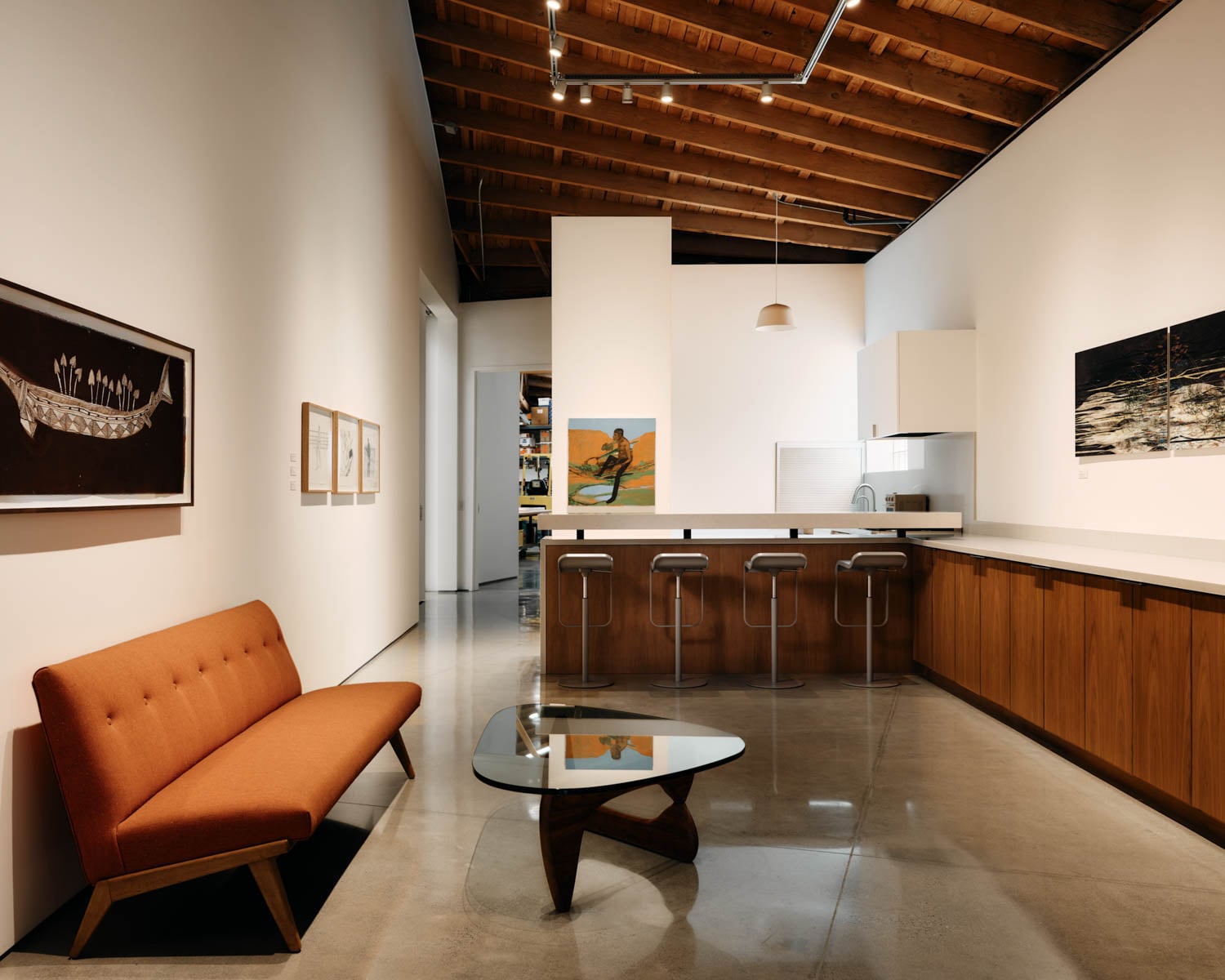 reception area with orange sofa and coffee table