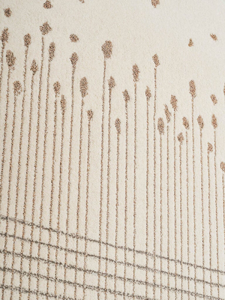 a pattern of wheat on a cream rug
