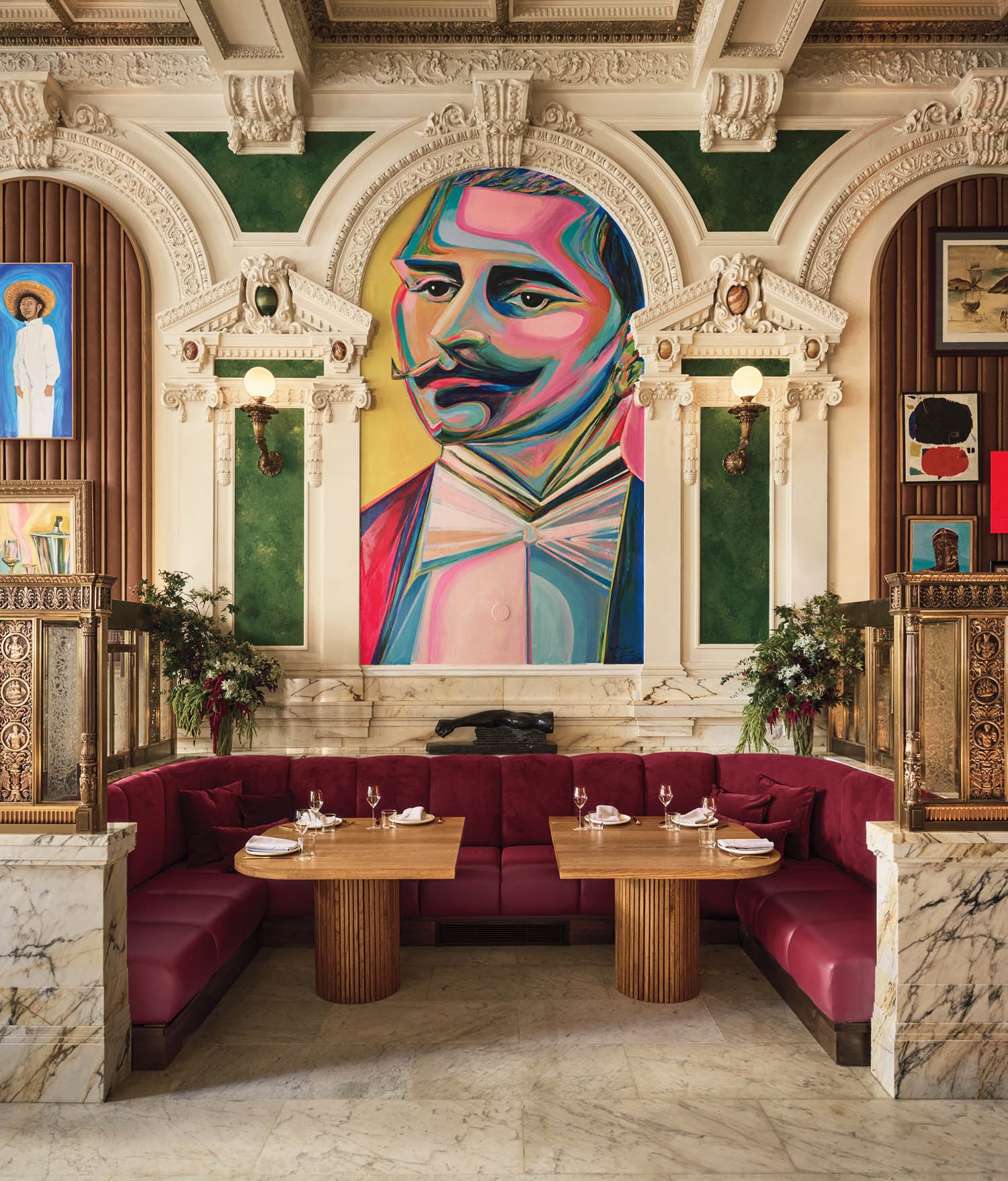 a colorful interior with portrait of a man's face on wall