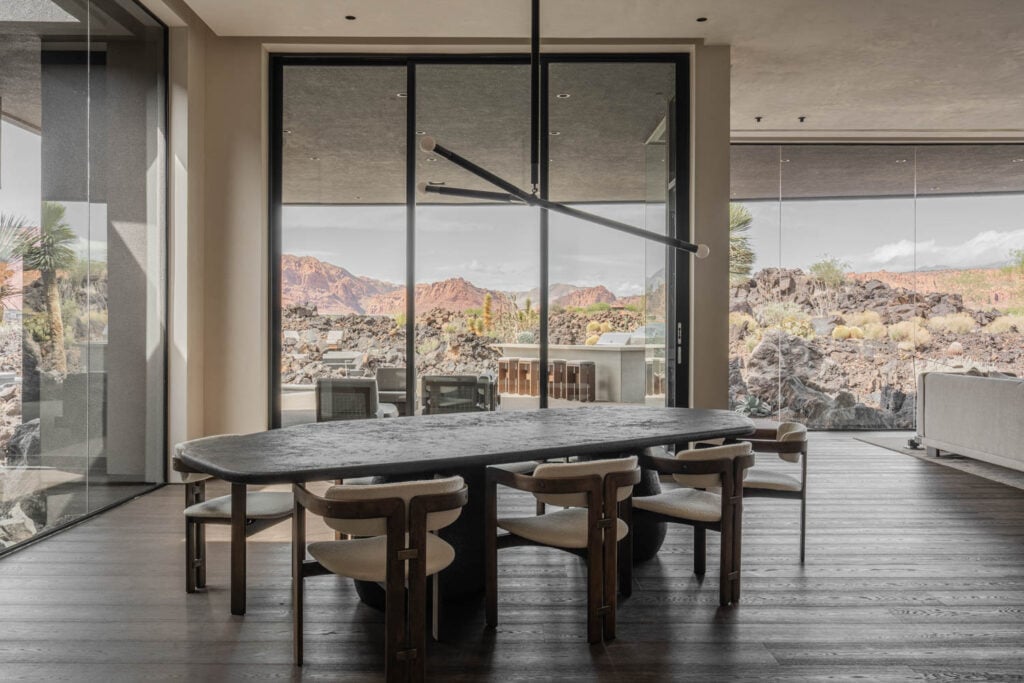 table and chairs in dining room with glass walls