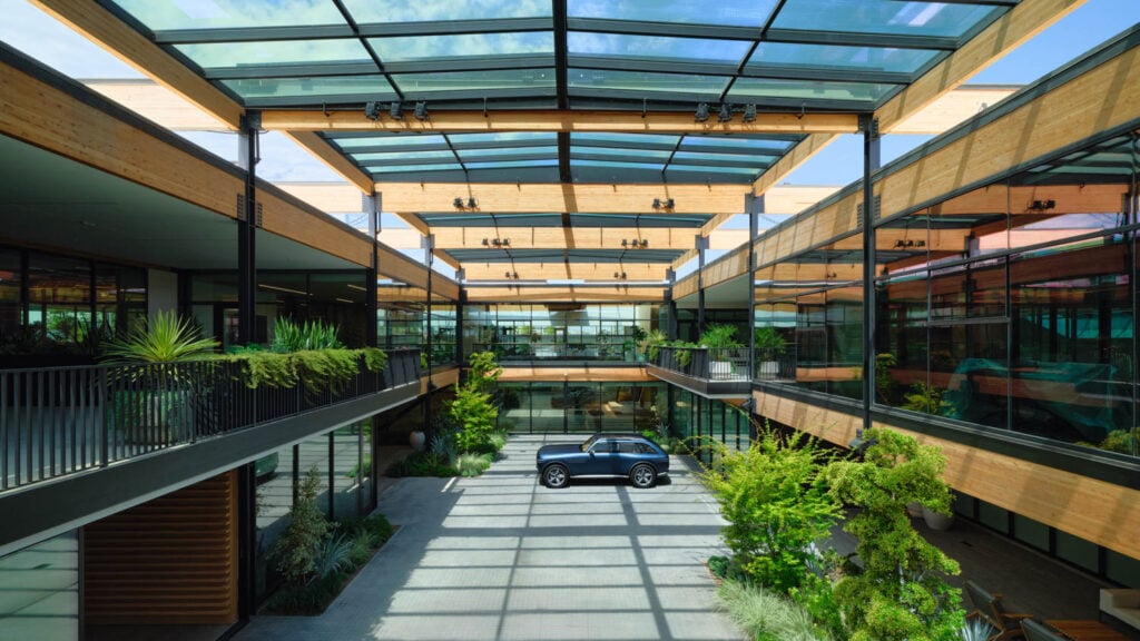 atrium space with slatted ceiling, balconies and car