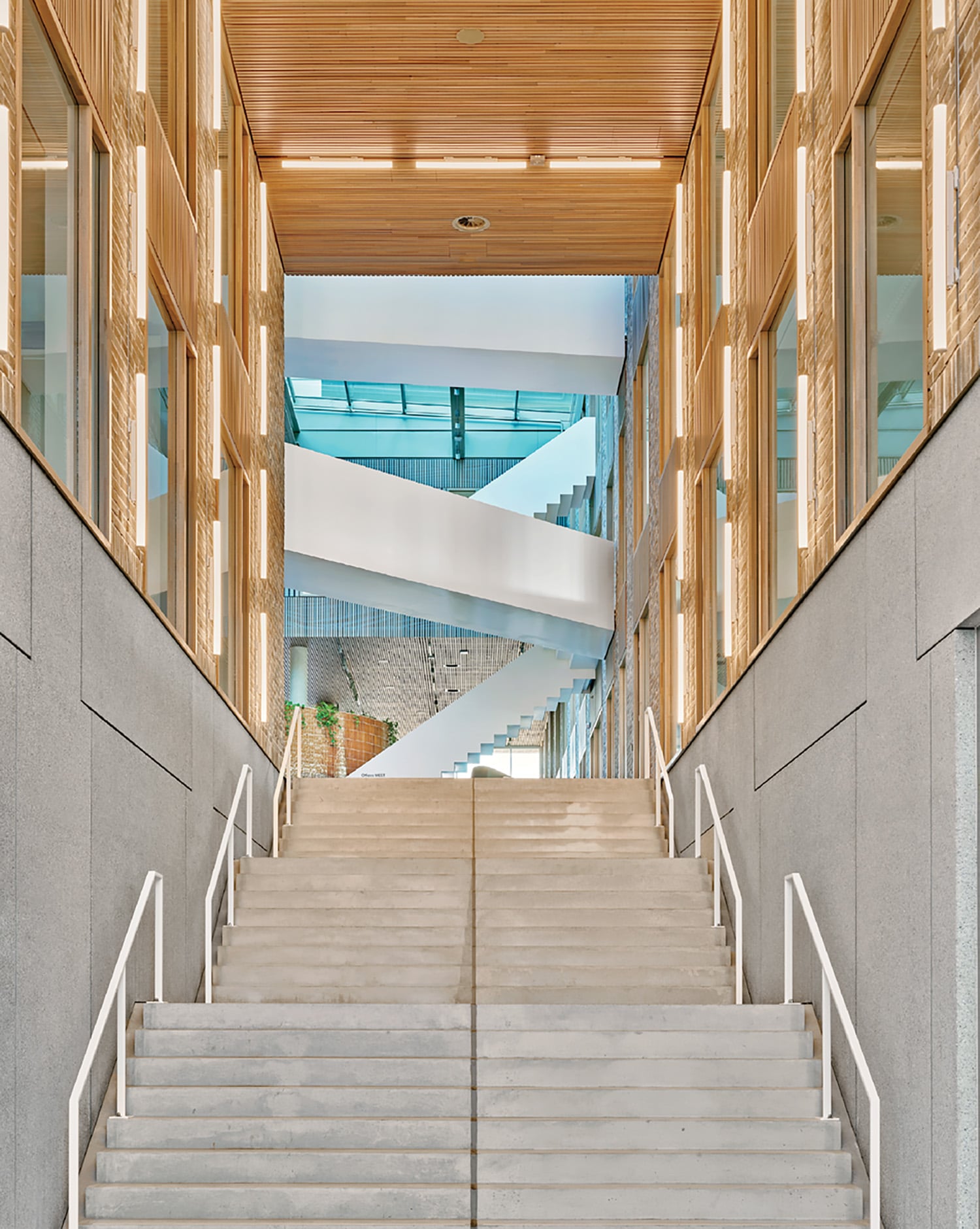 A staircase leading up to a building with a clock.