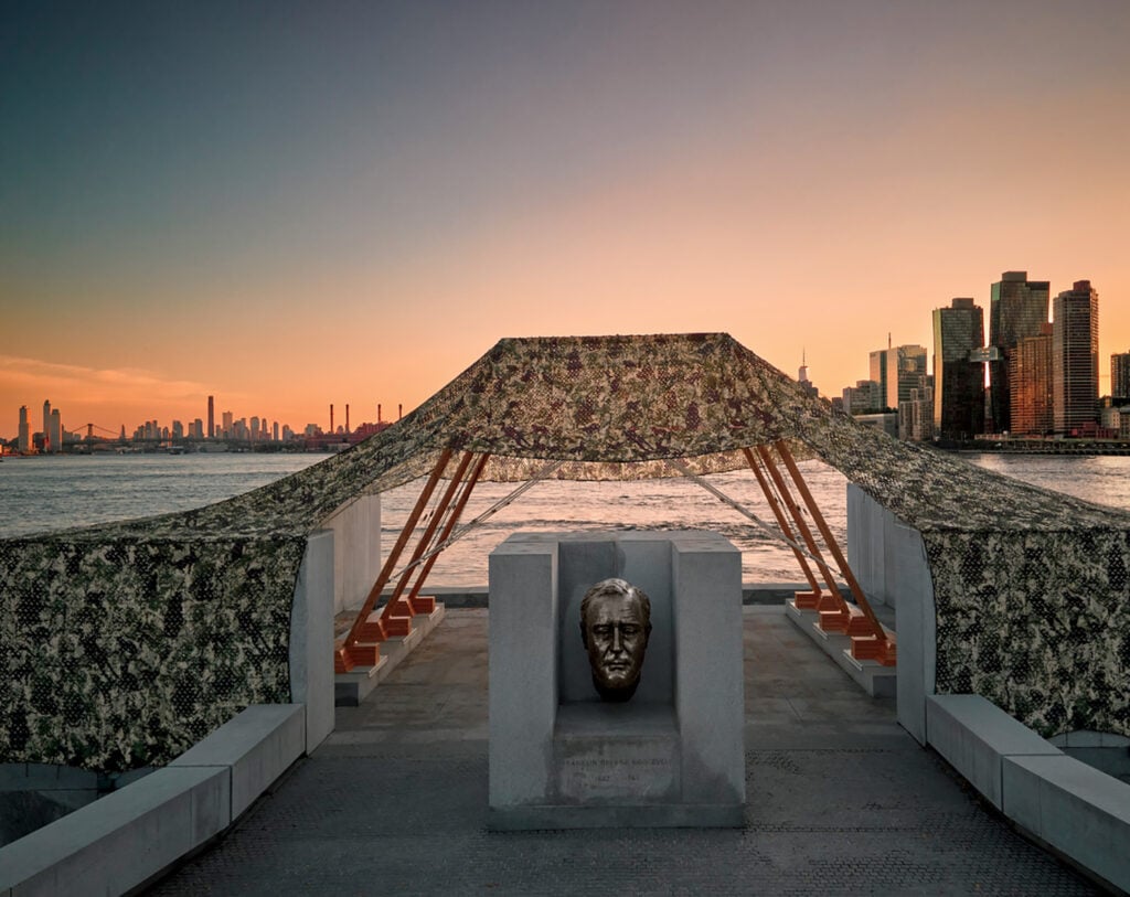 A sculpture with a large face on it.