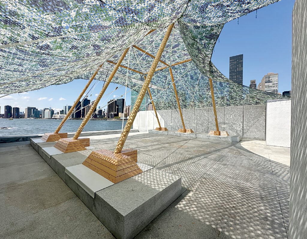 A sculpture made out of glass and wood.