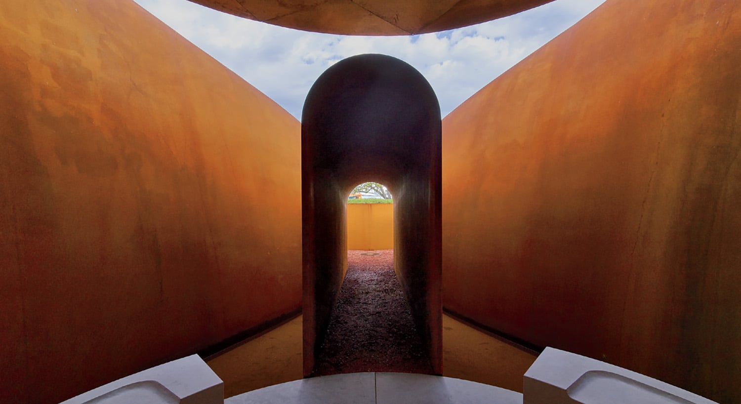 A room with a toilet and a sky view.