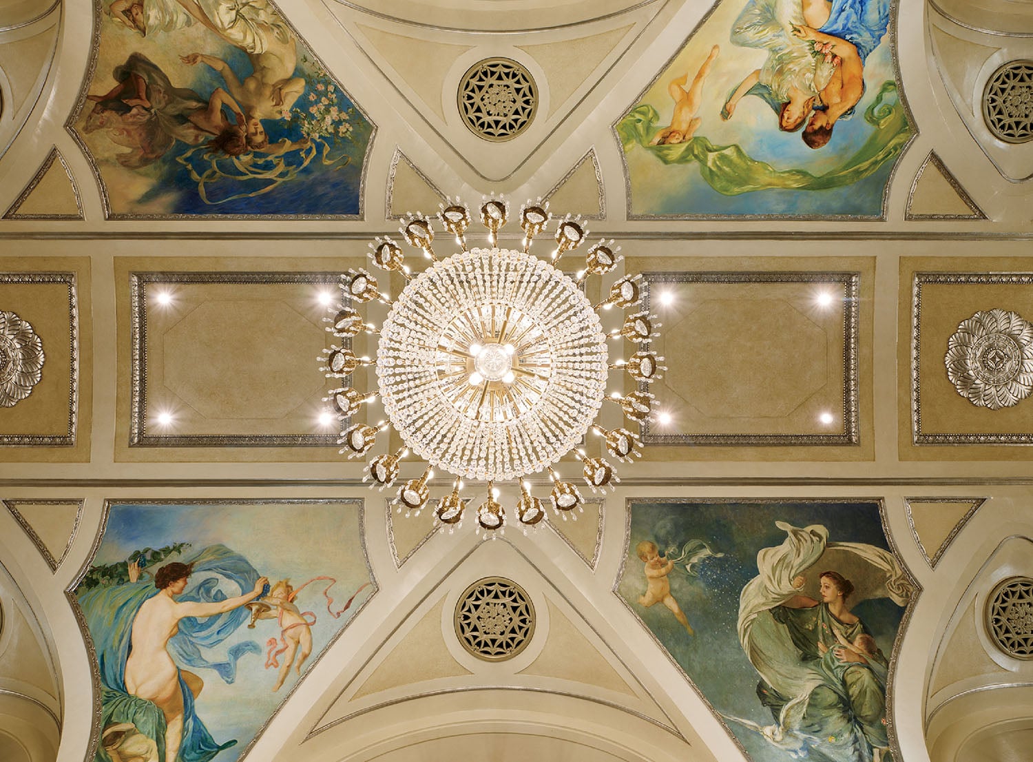 A ceiling with a chandel and a chandel.