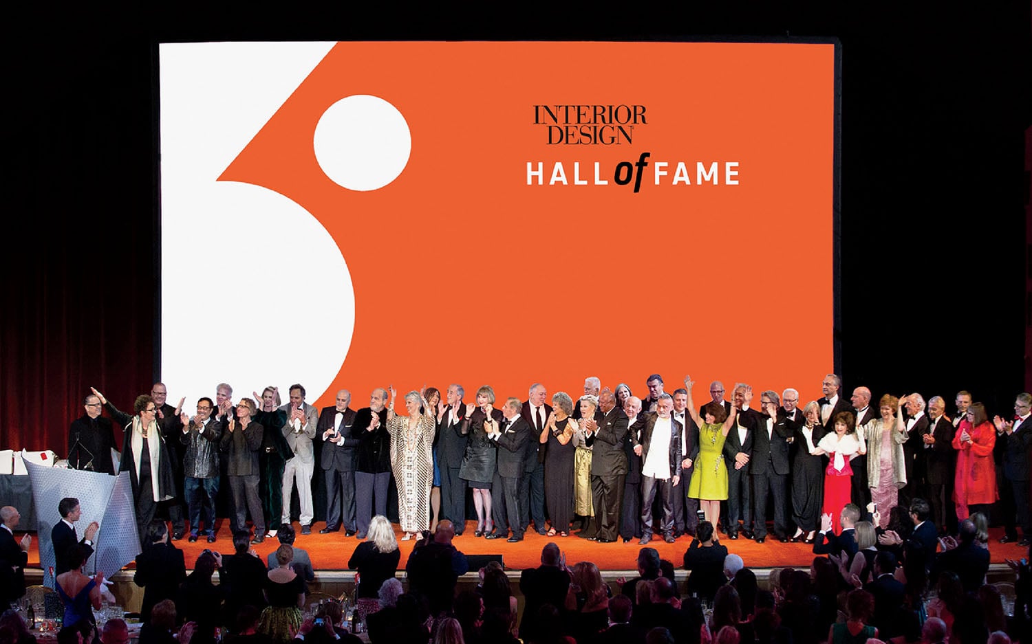 A group of people standing on a stage.