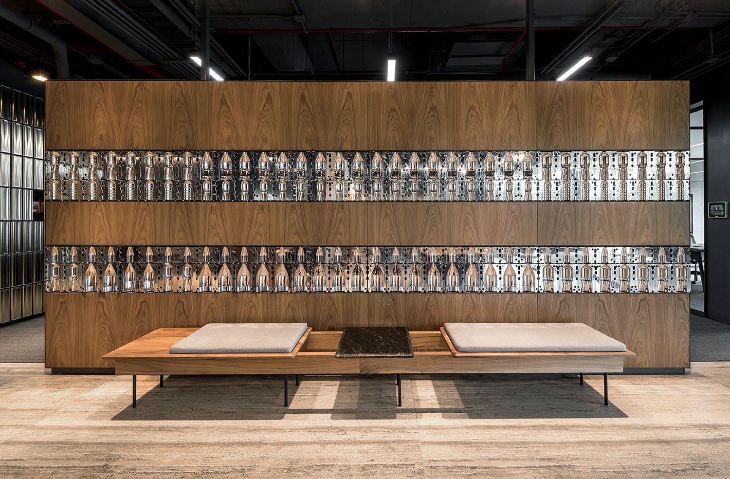 A wooden wall with glass bottles on it.