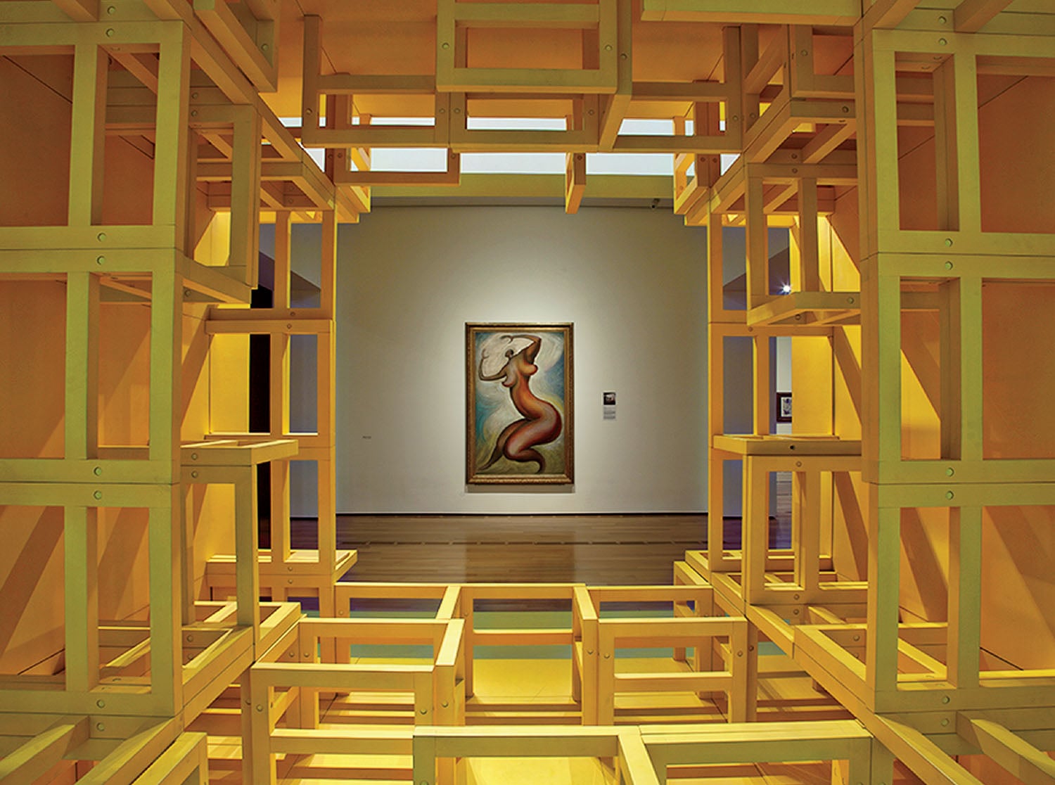 A room with a painting on the wall.