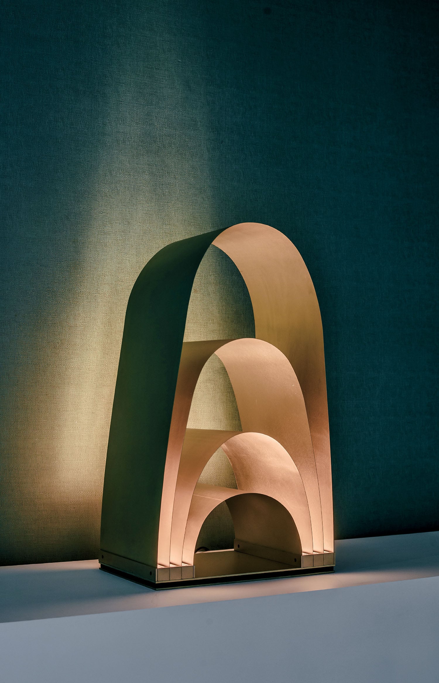A wooden sculpture with a light shining on it.