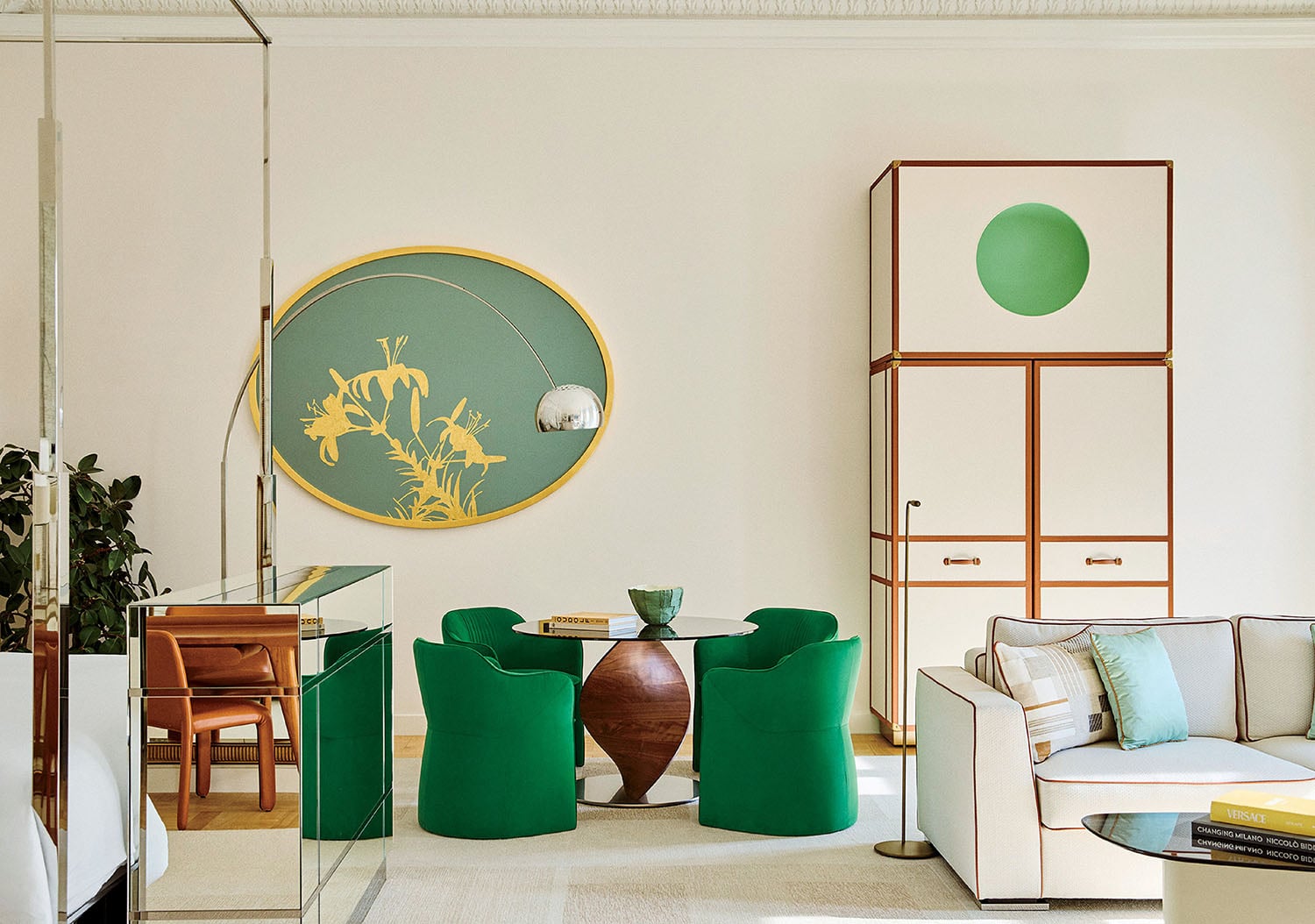 "A living room with a couch, chairs, and a table"