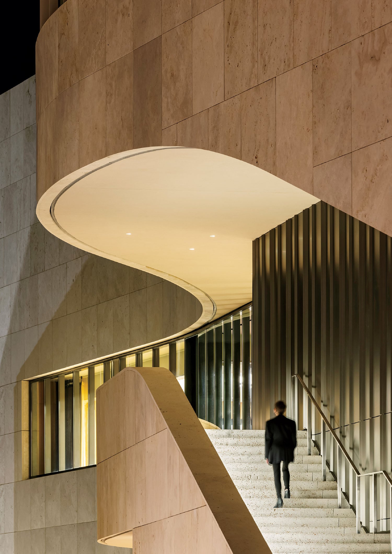 A man walking up a set of stairs.