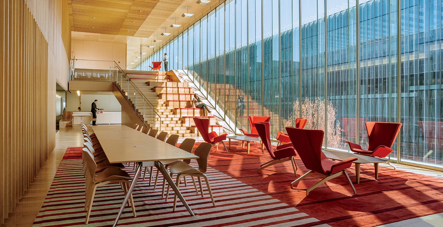 A room with a long table and chairs.