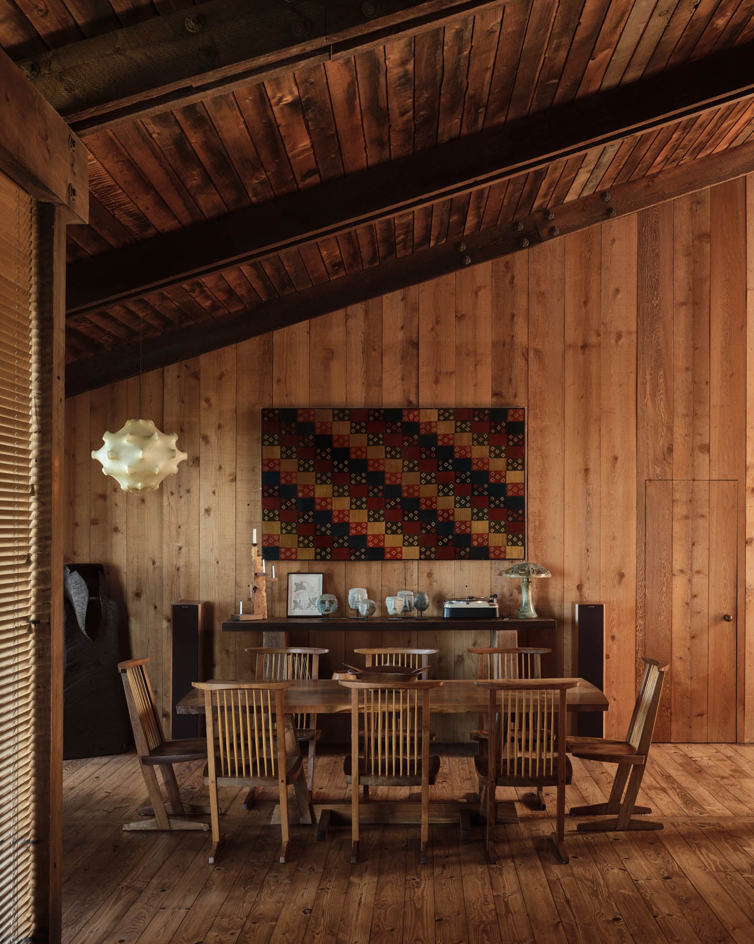 dining room with wooden walls