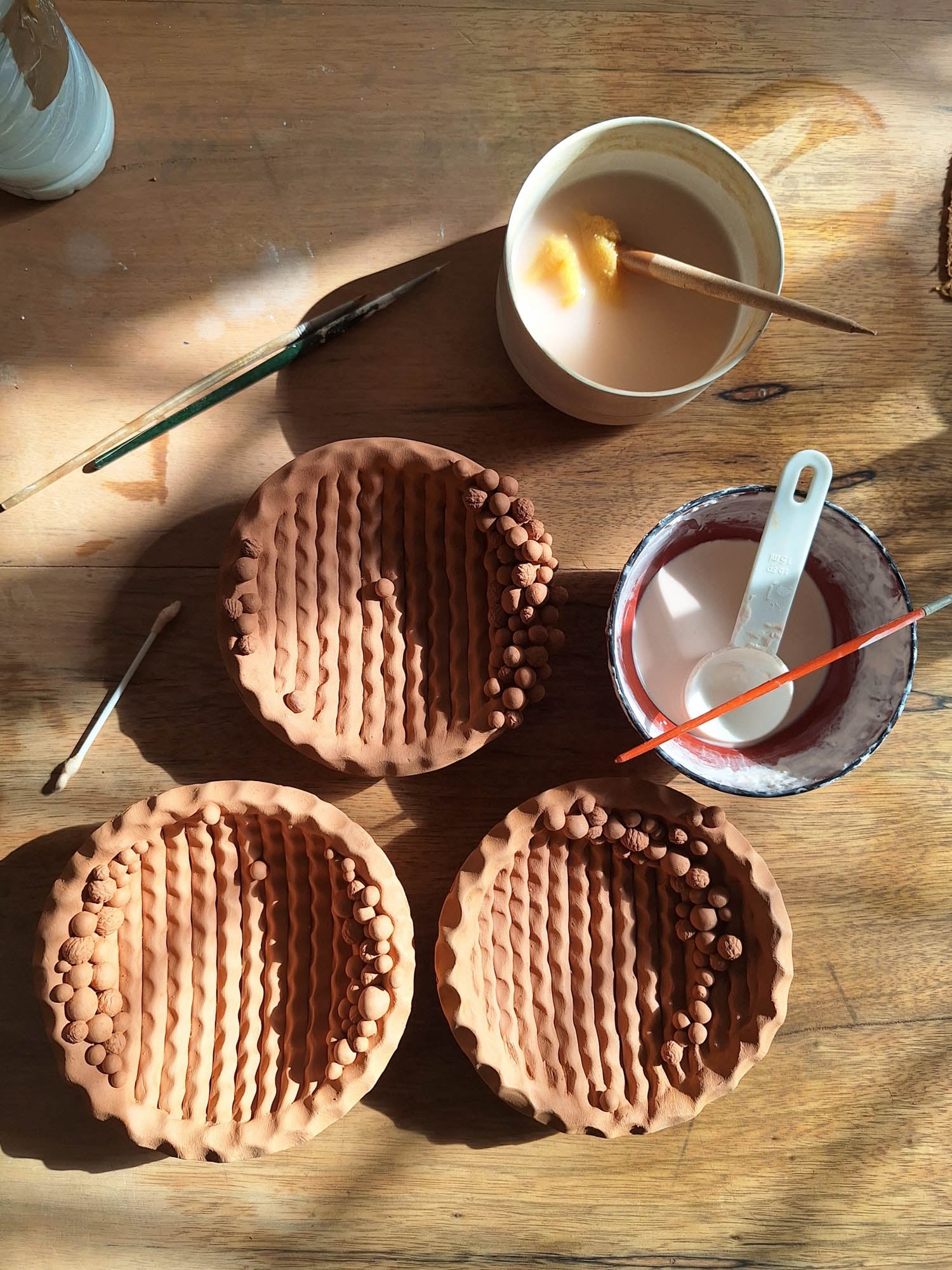 multiple brown bowls on table