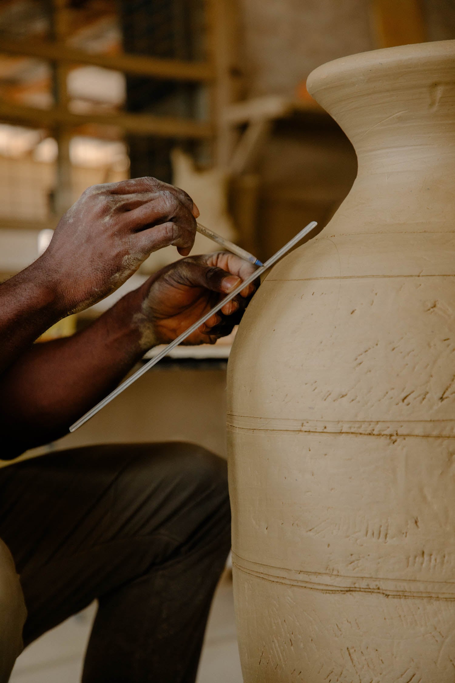 person working on sculpture