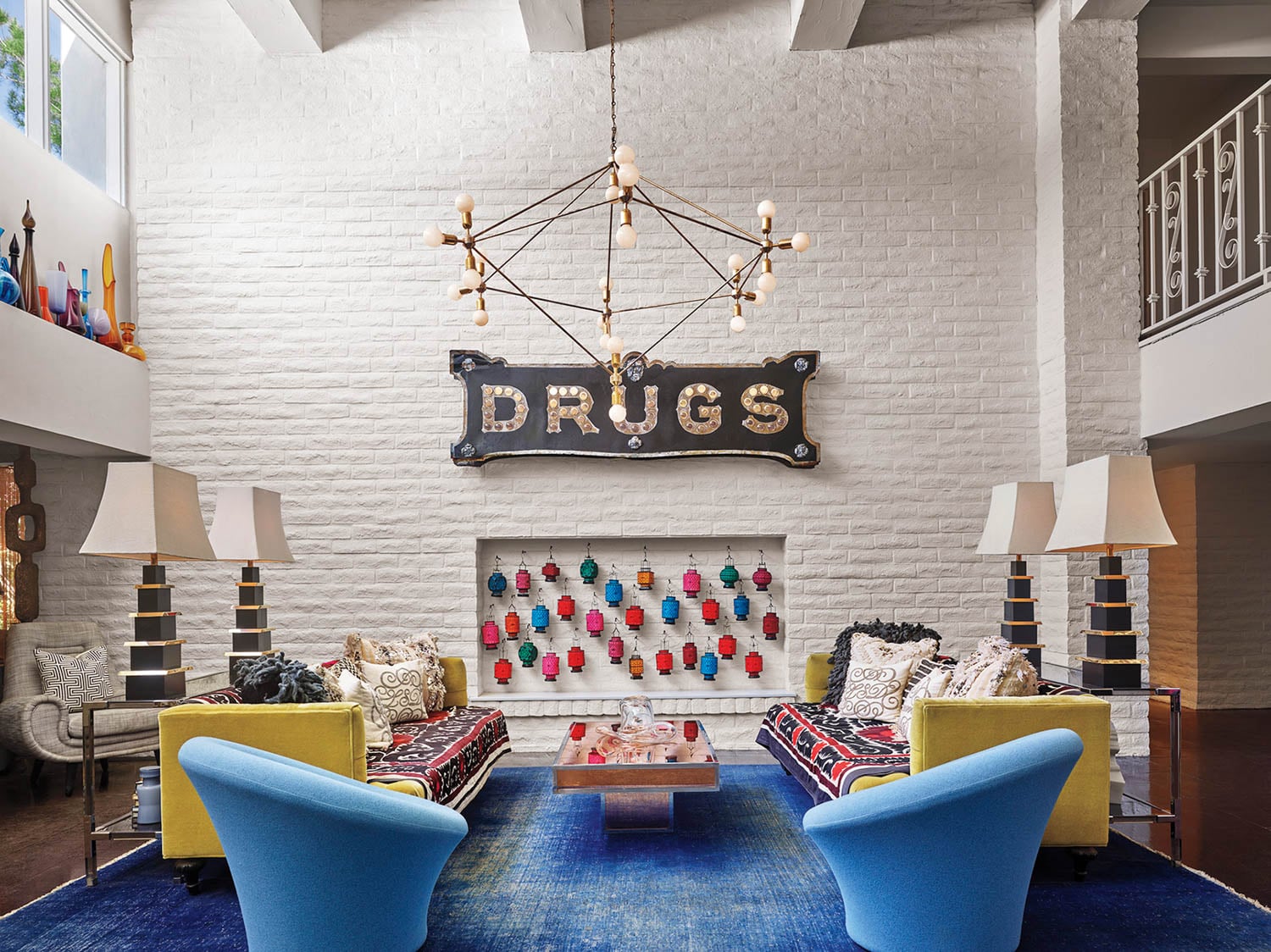 lobby area with blue chairs, yellow couches and Drugs sign
