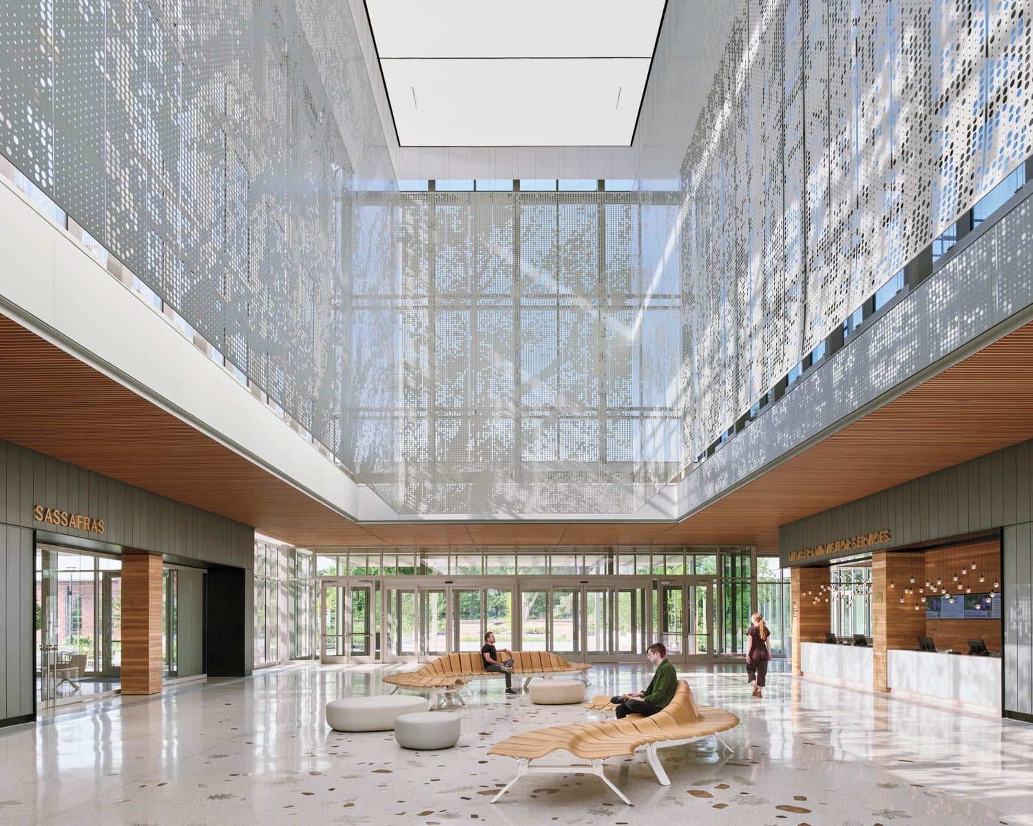 sitting lounge area with curved benches and installation