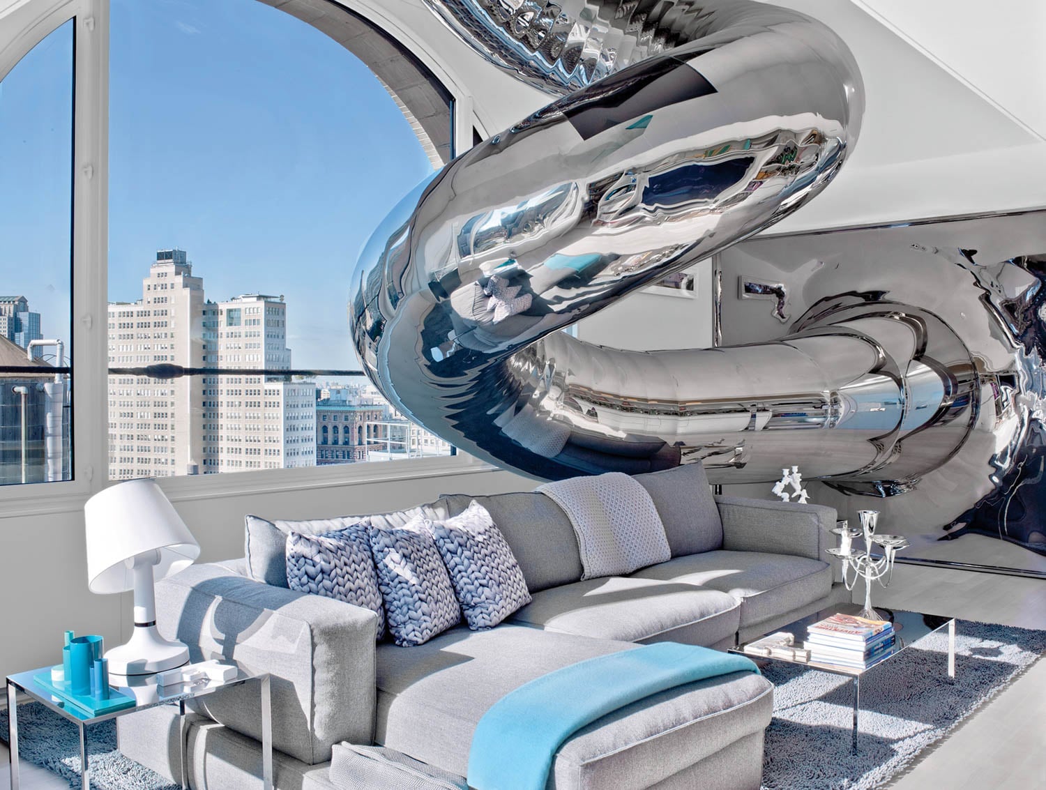 living room with curved silver sculpture and couch