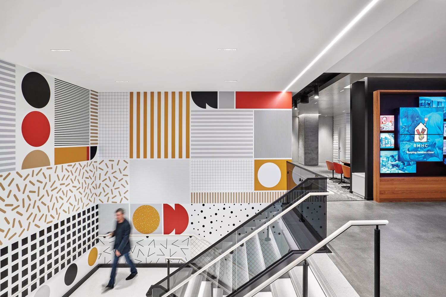 stairway area with bright colored graphics