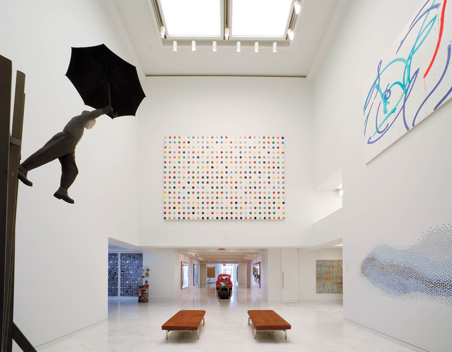 office lounge with artwork and brown benches